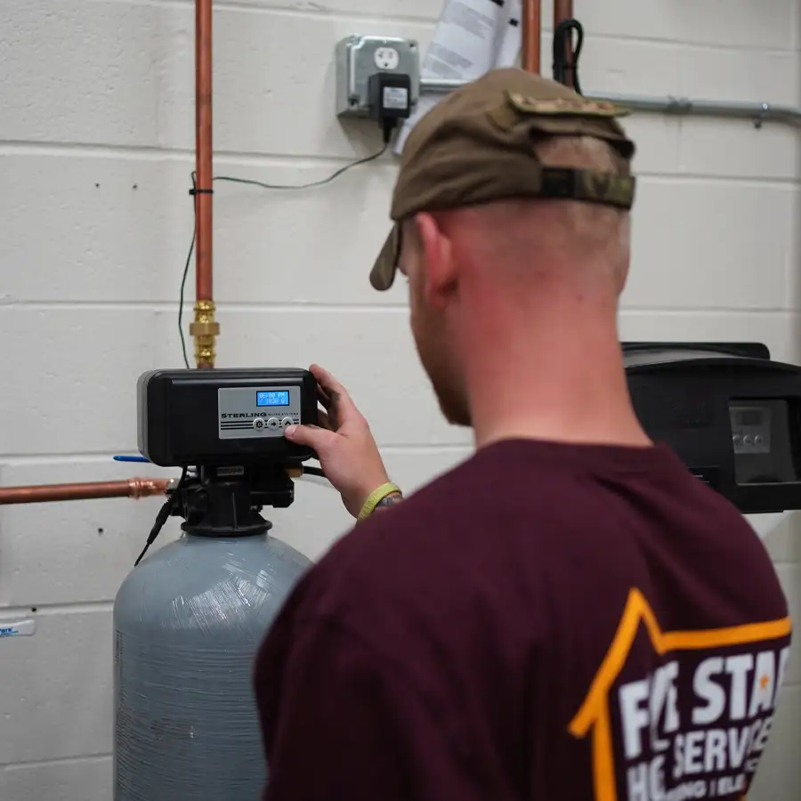 Plumber operating a water softener