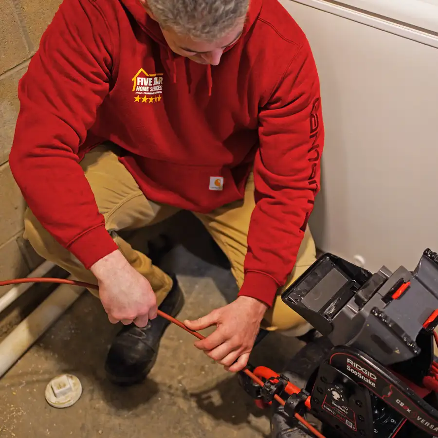 Plumber looking at a video screen